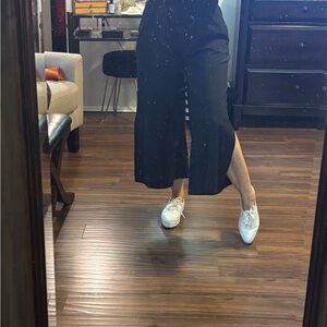 Black capri casual pants with with side leg slits and side pockets